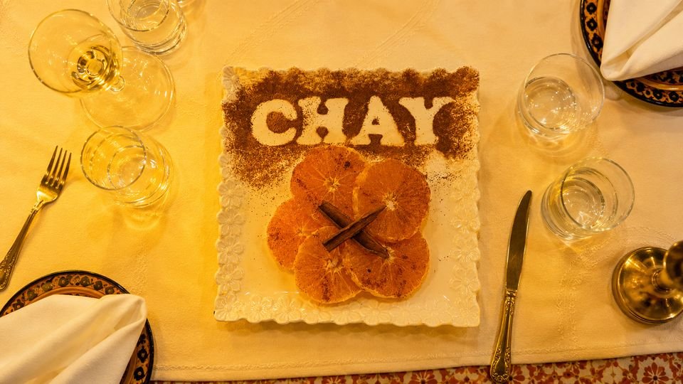 Orange with cinnamon, dessert served on a square plate
